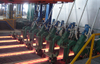 Withdrawal and straightening machine